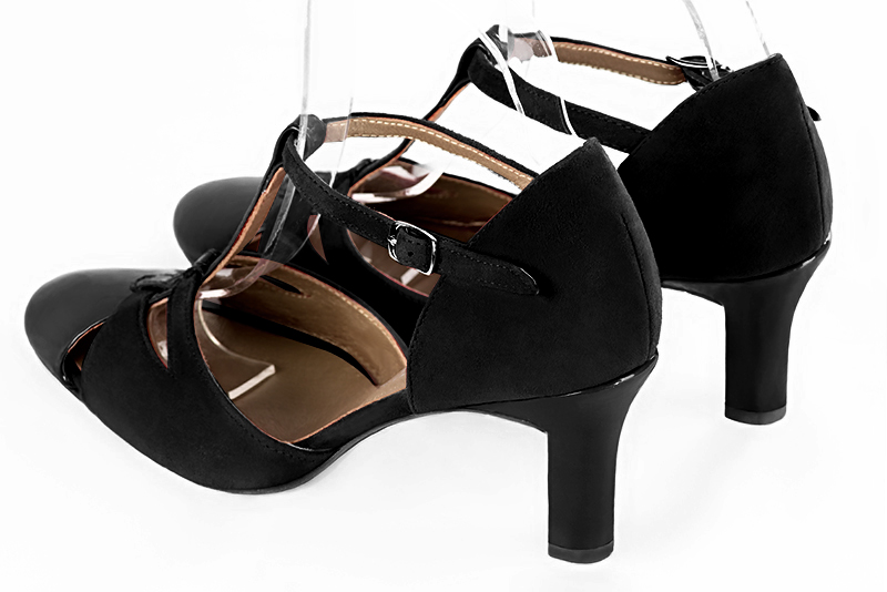 Gloss black women's T-strap open side shoes. Round toe. High kitten heels. Rear view - Florence KOOIJMAN